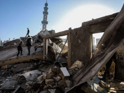 Palestinians inspect the area after Israeli attacks destroyed Al-Farooq Mosque completely and damaged buildings heavily in Al-Shabura neighborhood, Rafah, Gaza, on February 22, 2024.