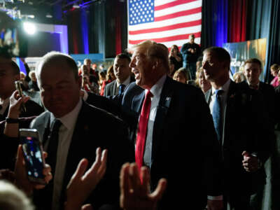 Former President Donald Trump smiles as he departs a Fox News Town Hall event at the Greenville Convention Center in Greenville, South Carolina, on February 20, 2024.