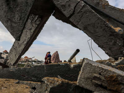 Palestinians inspect the collapsed building following an Israeli strike hit the house belonging to the Abu Nahal family in Rafah, Gaza, on February 18, 2024.