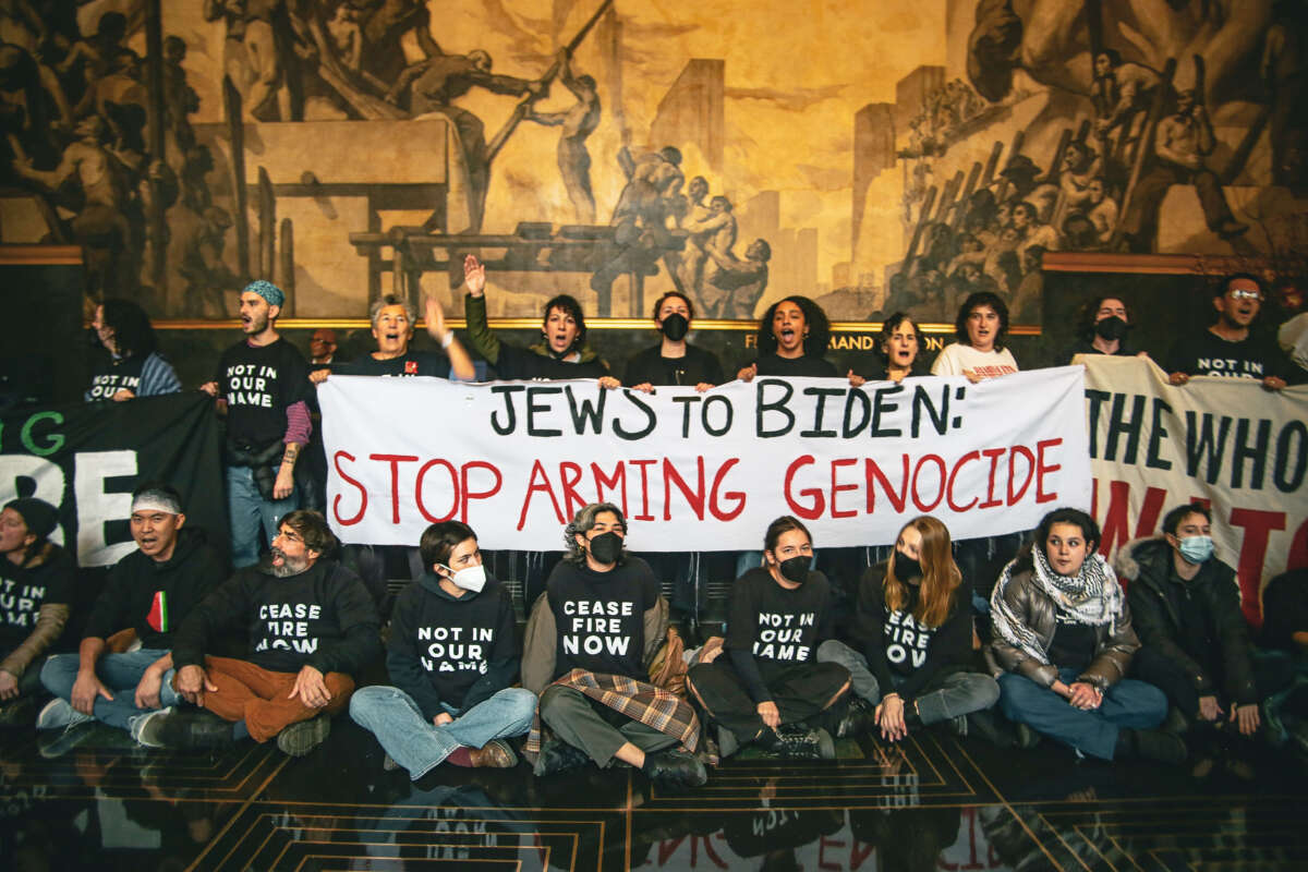 Jewish demonstrators and their allies engaged in a protest in the lobby at 30 Rockefeller Center on February 26, 2024, the same day President Joe Biden planned to be interviewed by NBC late night host Seth Myers.