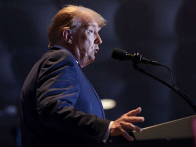 Former President Donald Trump speaks to supporters during an election night watch party at the State Fairgrounds on February 24, 2024, in Columbia, South Carolina.
