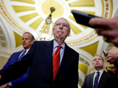Senate Minority Leader Mitch McConnell listens during a news conference after a weekly policy luncheon with Senate Republicans at the U.S. Capitol Building on February 6, 2024, in Washington, D.C.