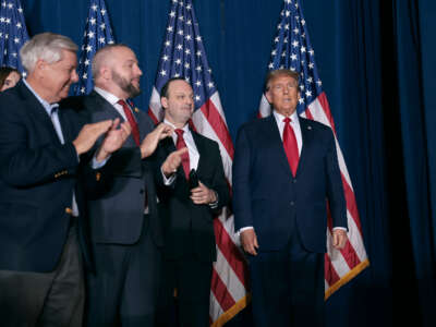 Former President Donald Trump walks on stage to speak during an election night watch party at the State Fairgrounds on February 24, 2024, in Columbia, South Carolina.