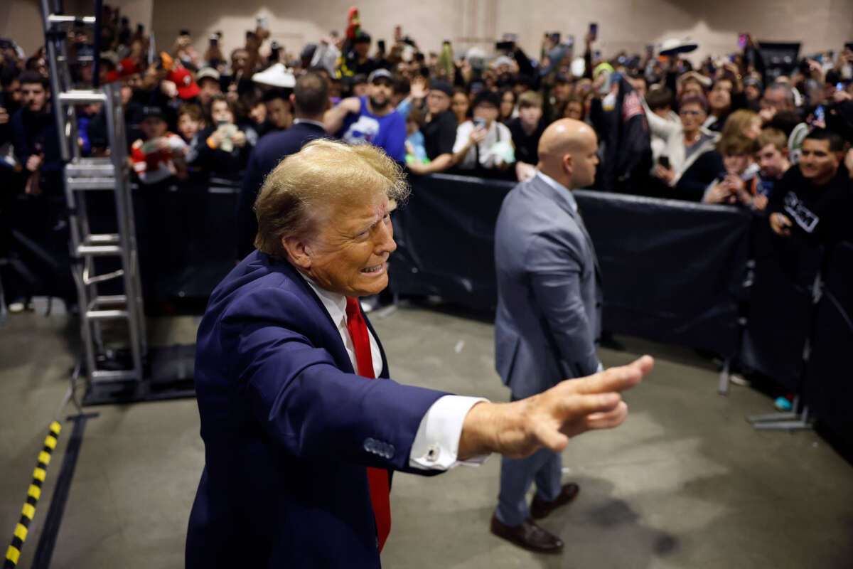 Republican presidential candidate and former President Donald Trump waves to attendees after introducing a new line of signature shoes at Sneaker Con at the Philadelphia Convention Center on February 17, 2024, in Philadelphia, Pennsylvania.