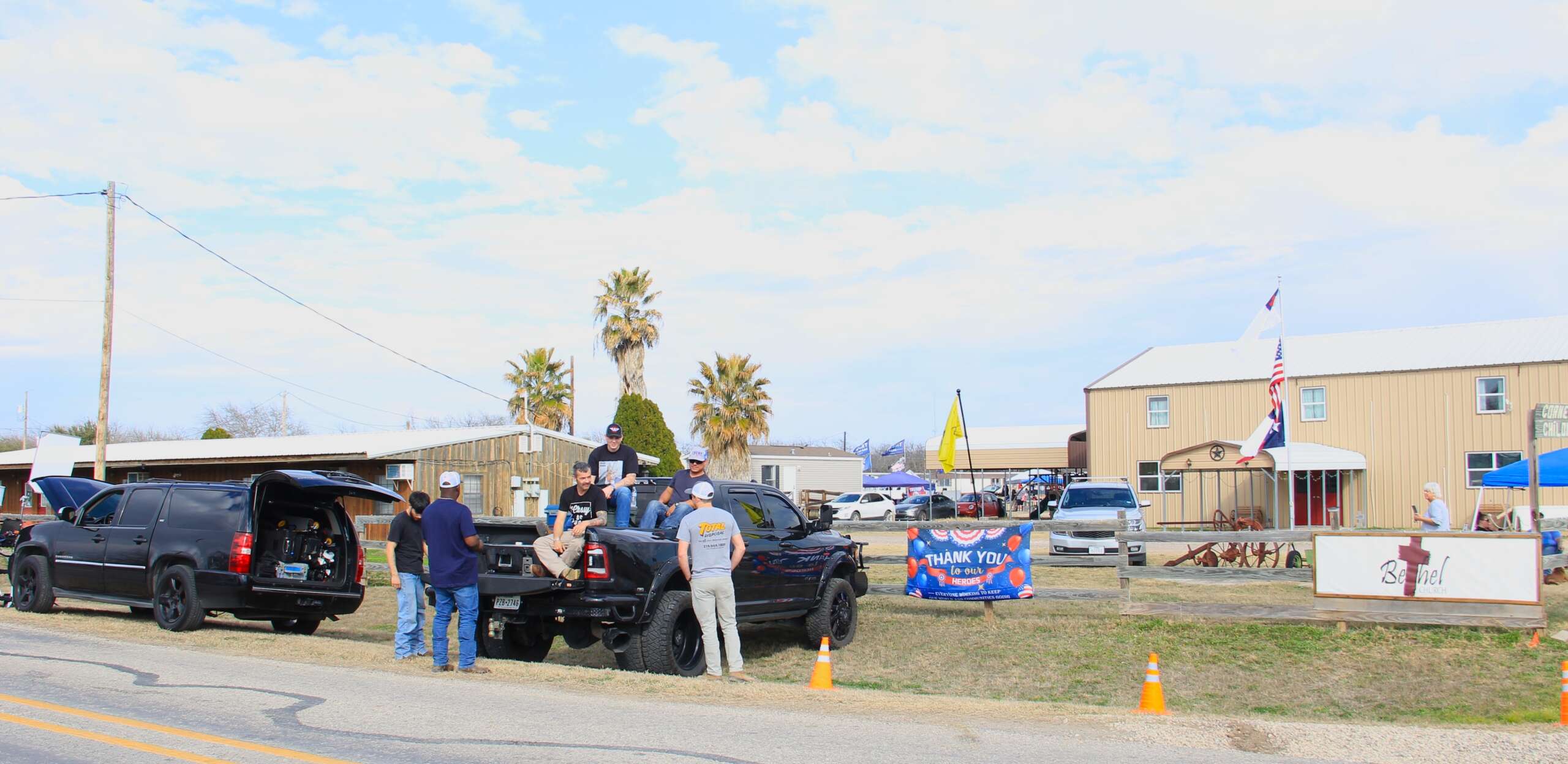 Supporters of the "Take Our Border Back" convoy of Christian nationalists tailgate outside the Cornerstone Children's before the arrival of the convoy on February 2 in Quemado, Texas.