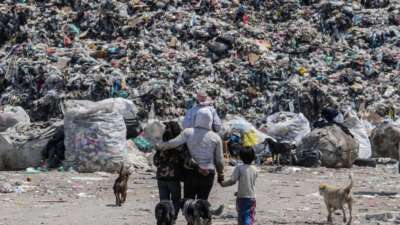 People during the collection and separation of waste that arrives daily at the largest garbage dump in Mexico Bordo de Xochiaca, on August 31, 2021, in Mexico City, Mexico.