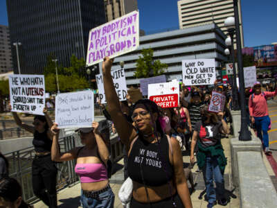 People marching in a pro-choice march with placards. Protestors gathered to voice their anger at the leaked Supreme Court documents.