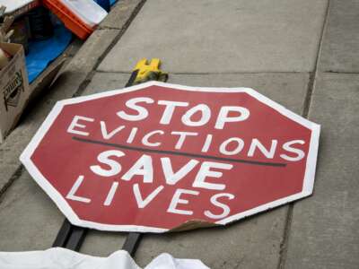 Sign that says "stop evictions save lives"