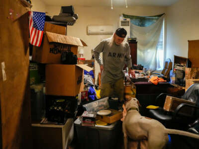 Army Veteran Ronald Payne packs his belongings in preparation for an eviction due to paperwork issues on November 17, 2023, in Houston.