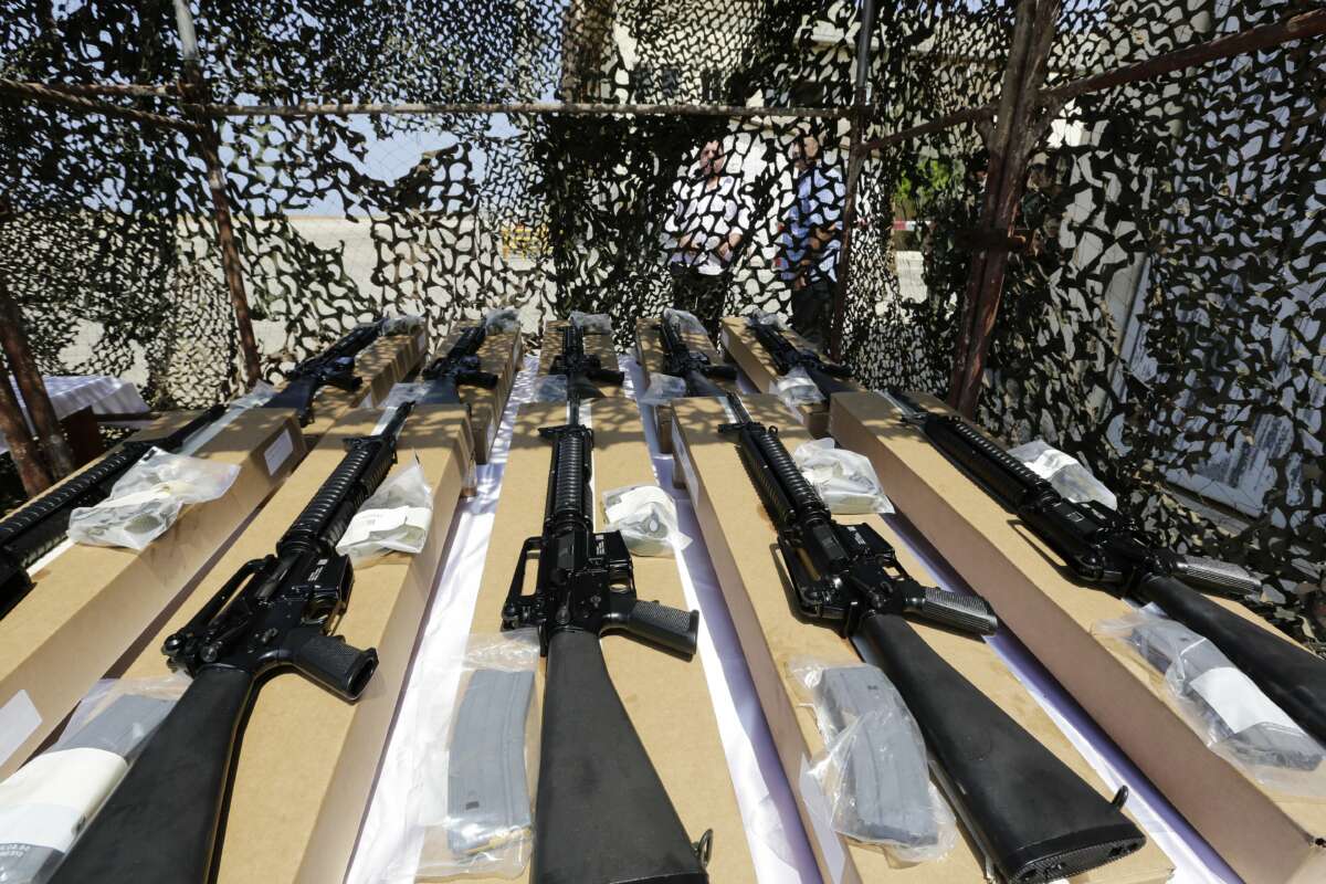U.S. army M16 riffles are displayed after a shipment of weapons was delivered by a U.S. air force plane on August 29, 2014, at a Lebanese military base at Beirut International Airport.