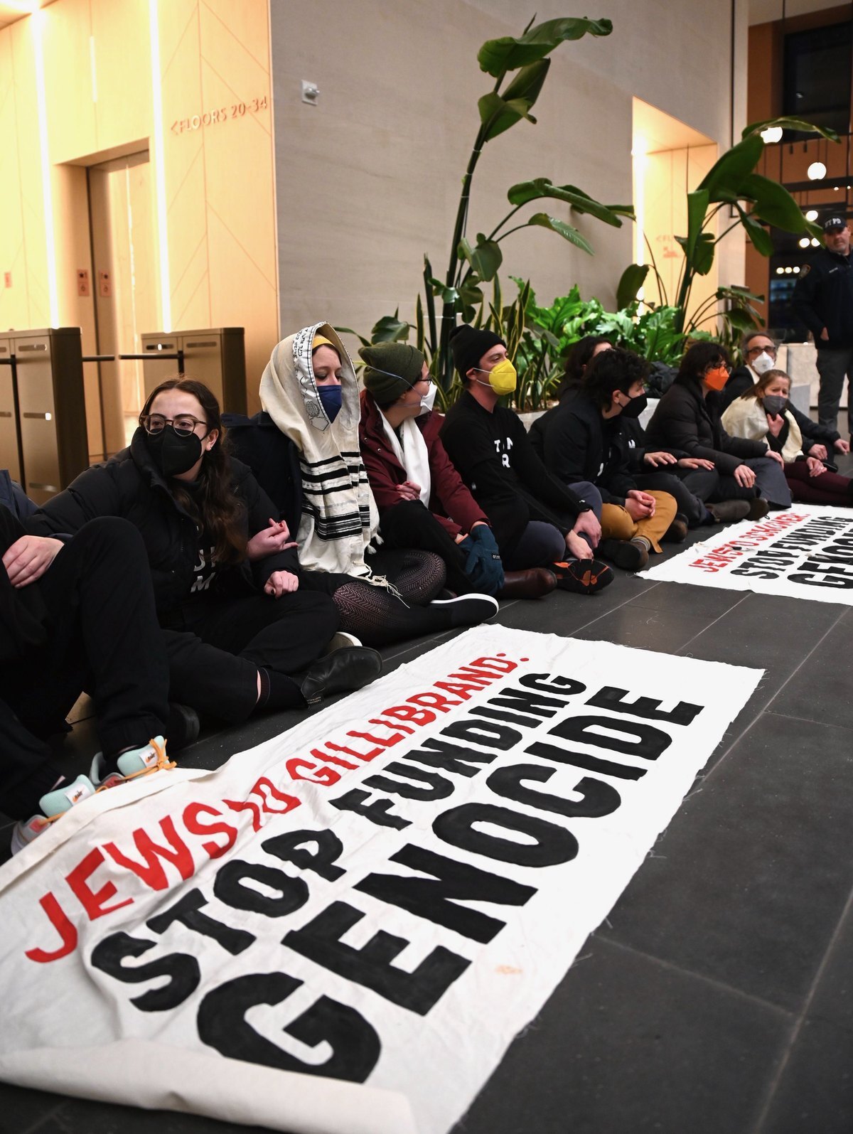 Jewish Voice for Peace protesters and their allies, many holding signs, demonstrate outside the American Israel Public Affairs Committee (AIPAC) headquarters in New York City on February 22, 2024, calling for a permanent ceasefire in Gaza.
