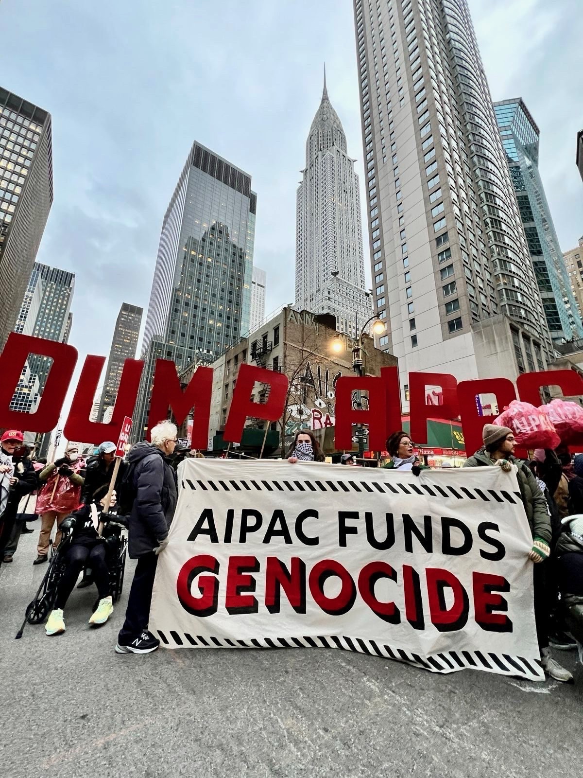 Jewish Voice for Peace protesters and their allies, many holding signs, demonstrate outside the American Israel Public Affairs Committee (AIPAC) headquarters in New York City on February 22, 2024, calling for a permanent ceasefire in Gaza.