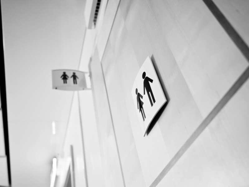 Sign for restroom with male and female figures