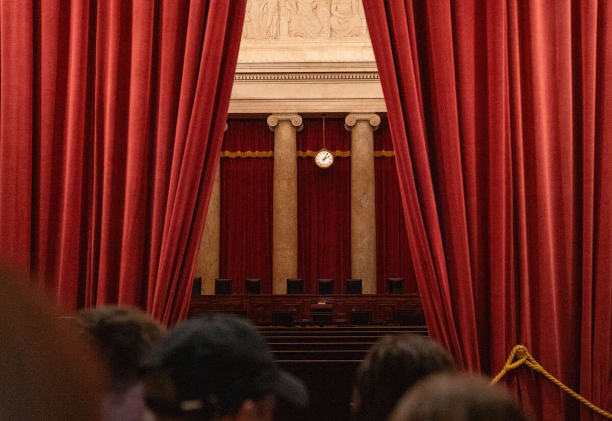 Tourists look inside the chamber of the U.S. Supreme Court on February 29, 2024, in Washington, D.C.