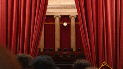 Tourists look inside the chamber of the U.S. Supreme Court on February 29, 2024, in Washington, D.C.