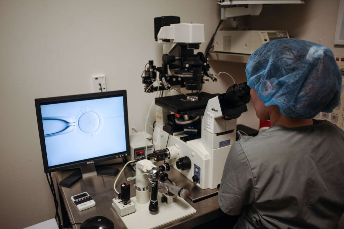 An embryologist is seen at work at the Virginia Center for Reproductive Medicine, in Reston, Virginia, on June 12, 2019.