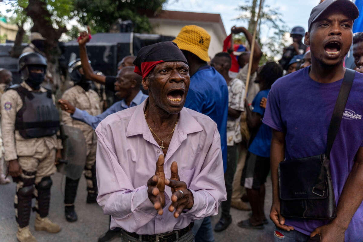 People protest during a demonstration against Haitian Prime Minister Ariel Henry and the United Nations amid a health and security crisis in Port-au-Prince on October 21, 2022.