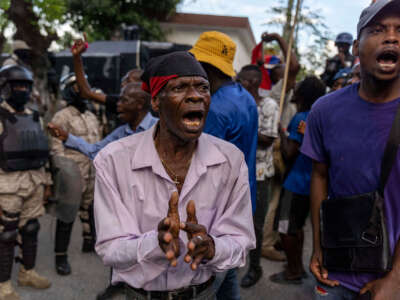 People protest during a demonstration against Haitian Prime Minister Ariel Henry and the United Nations amid a health and security crisis in Port-au-Prince on October 21, 2022.