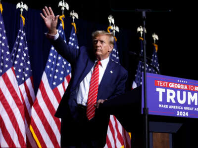 Former President Donald Trump leaves the stage a the conclusion of a campaign rally at the Forum River Center on March 9, 2024, in Rome, Georgia.