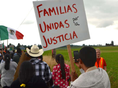 Familias Unidas por la Justicia members join National Farm Worker's Ministry members in a march in July, 2015.