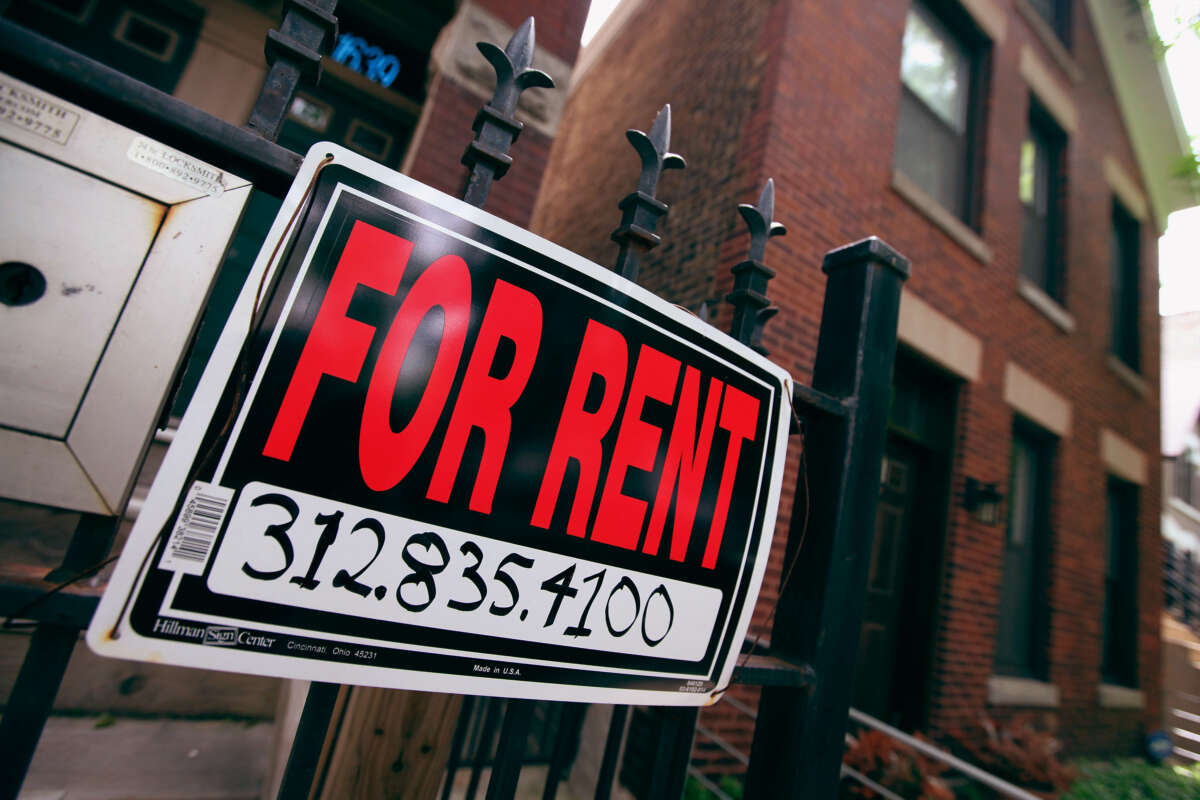 A For Rent sign stands in front of a house in Chicago, Illinois.