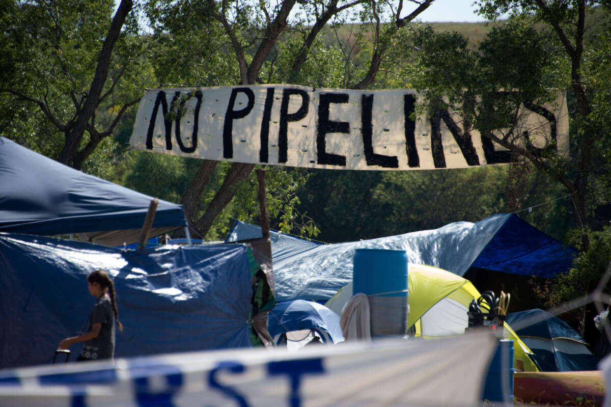 A sign reads No Pipelines in this picture taken on September 3, 2016, shows makeshift tents at an encampment where hundreds of people have gathered to join the Standing Rock Sioux Tribe's protest against the construction of the Dakota Access Pipe, near Cannon Ball, North Dakota.