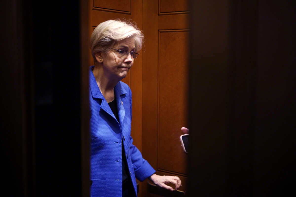 Sen. Elizabeth Warren stands in an elevator