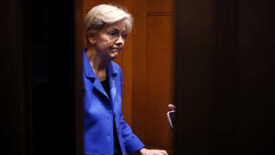 Sen. Elizabeth Warren stands in an elevator