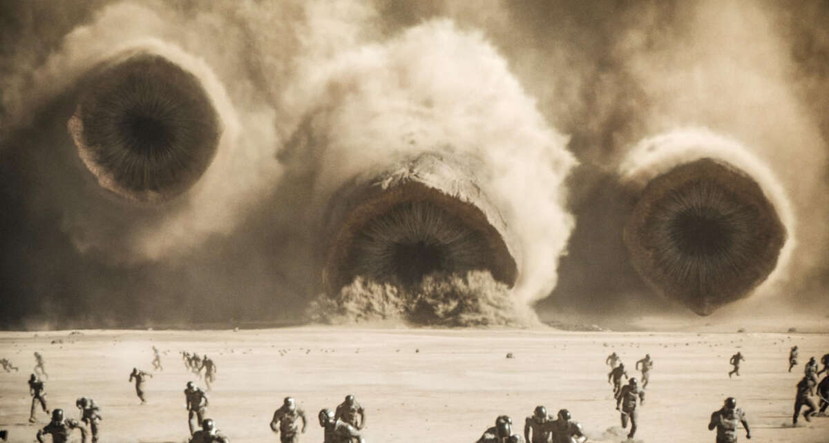 Sandworms charge forward in a scene from Dune: Part 2.