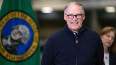 Washington State Gov. Jay Inslee and other leaders speak to the press on March 28, 2020, in Seattle, Washington.