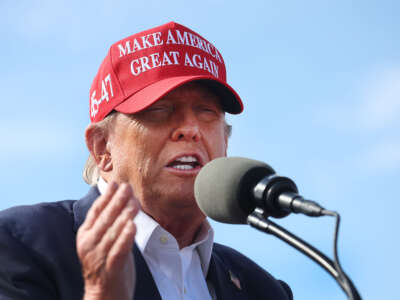 Former President Donald Trump speaks to supporters during a rally at the Dayton International Airport on March 16, 2024, in Vandalia, Ohio.