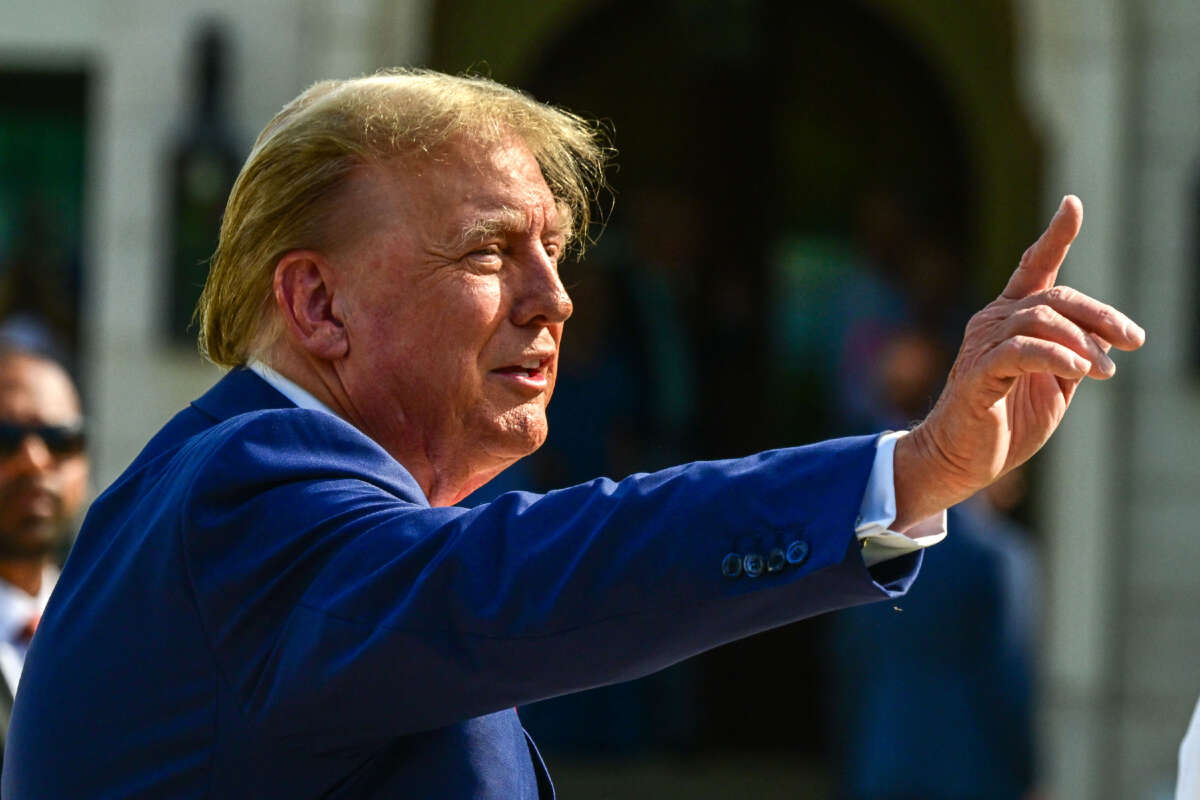 Former President Donald Trump arrives to vote in Florida's primary election at a polling station at the Morton and Barbara Mandel Recreation Center in Palm Beach, Florida, on March 19, 2024.