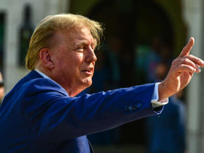 Former President Donald Trump arrives to vote in Florida's primary election at a polling station at the Morton and Barbara Mandel Recreation Center in Palm Beach, Florida, on March 19, 2024.