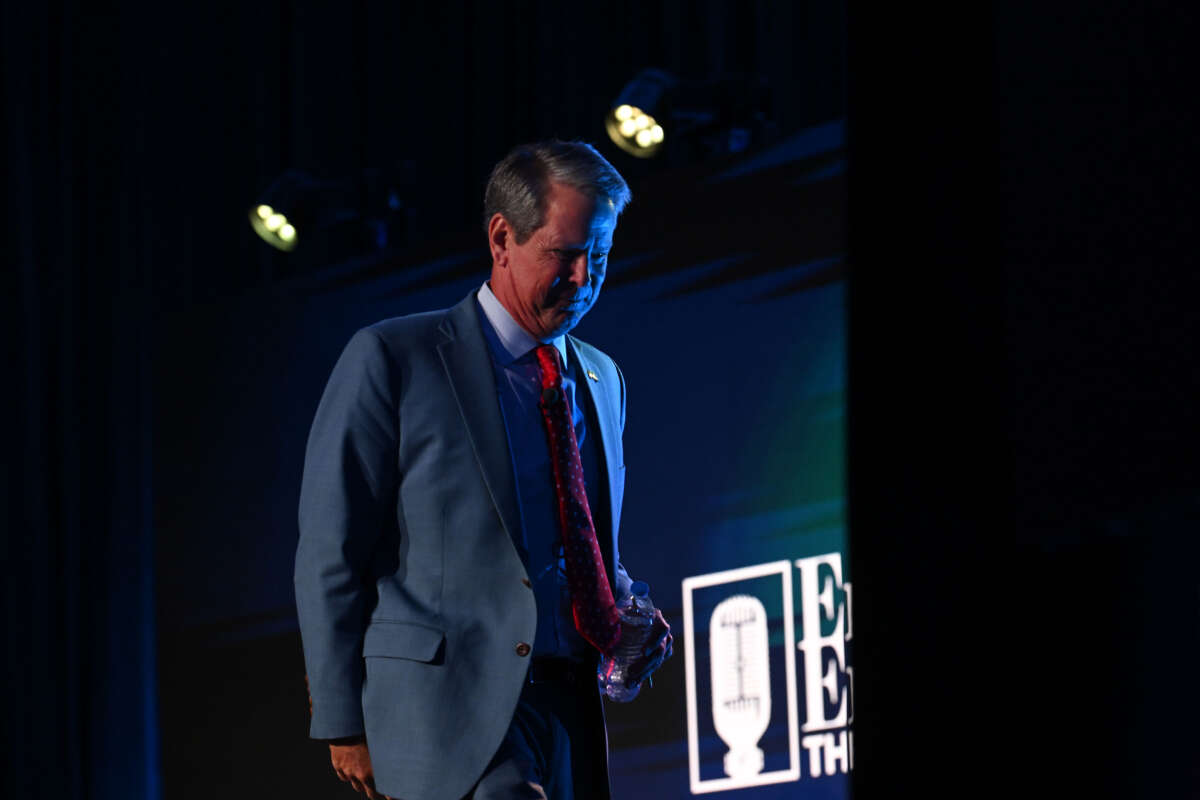 Georgia Gov. Brian Kemp exits the stage after speak during The Gathering conservative conference hosted and moderated by talk radio host Erick Erickson at the Grand Hyatt hotel on August 18, 2023, in Atlanta, Georgia.