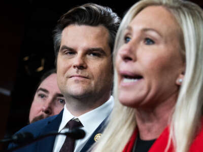 Reps. Matt Gaetz (center) and Marjorie Taylor Greene (right) conduct a news conference in the Capitol Visitor Center on February 6, 2024.