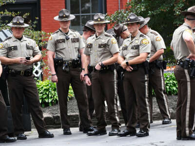 Officers with the Somerset County Sheriffs gather outside the courthouse at the Cumberland County Courthouse in Portland, Maine, on September 12, 2019.