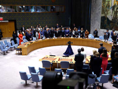 The UN security council sits at a horseshoe-shaped table