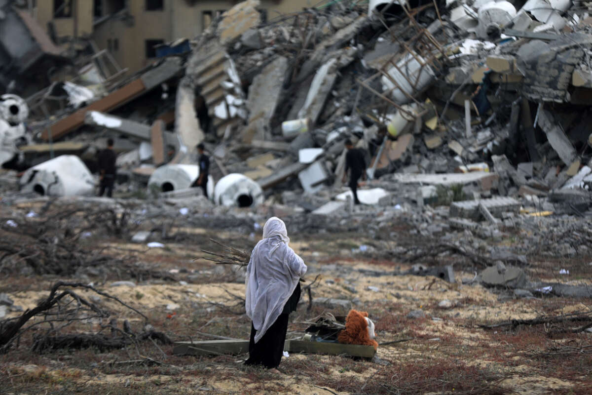 Palestinians collect remaining belongings from the rubble of destroyed houses after Israeli attack Gaza City, Gaza, on March 25, 2024.