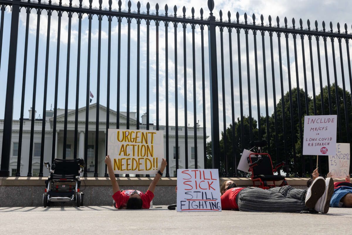 Protestors lay down outside the White House to call attention to those suffering from Myalgic Encephalomyelitis and long COVID on September 19, 2022, in Washington, D.C.
