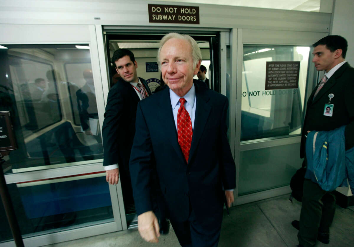 Sen. Joseph Lieberman walks off the Capitol subway after speaking to reporters about the health care reform bill that was being debated in the Senate, on December 15, 2009, in Washington, D.C.