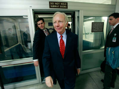 Sen. Joseph Lieberman walks off the Capitol subway after speaking to reporters about the health care reform bill that was being debated in the Senate, on December 15, 2009, in Washington, D.C.