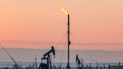 Flares burning off gas at the South Belridge Oil Field and hydraulic fracking site, which is the fourth-largest oil field in California, in Kern County, San Joaquin Valley, California.