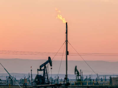 Flares burning off gas at the South Belridge Oil Field and hydraulic fracking site, which is the fourth-largest oil field in California, in Kern County, San Joaquin Valley, California.