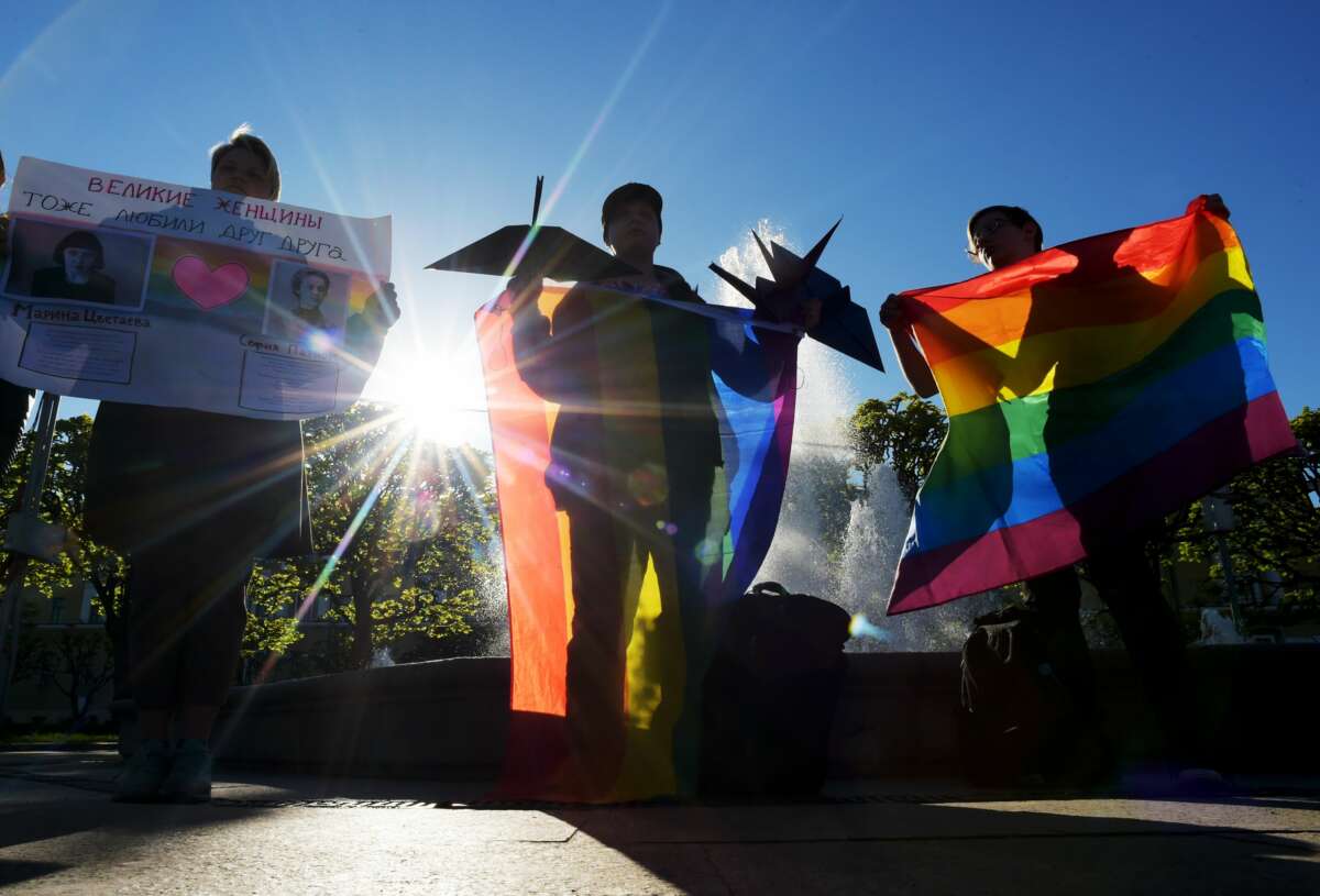 Gay right activists attend a rally as they mark World Day Against Homophobia and Transphobia in Saint Petersburg on May 17, 2019.
