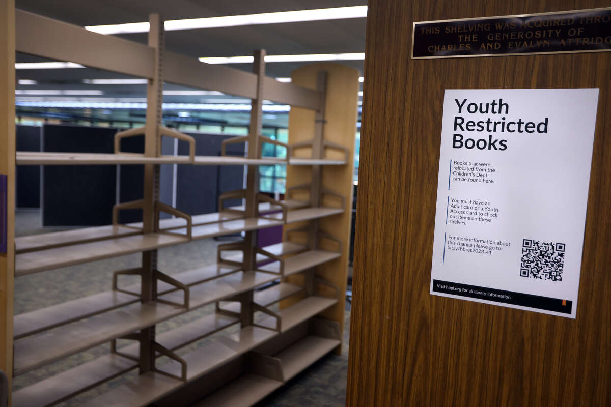 Two new rows of shelves dedicated to Youth Restricted Books sit mostly empty at the Huntington Beach Central Library in Huntington Beach, California, on February 21, 2024.