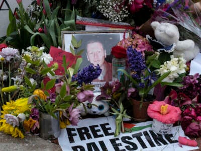 People leave notes and flowers during the Global Days of Action for Palestine to commemorate the U.S. Air Force active-duty airman Aaron Bushnell outside the Israeli Embassy in Washington, D.C., on March 2, 2024.