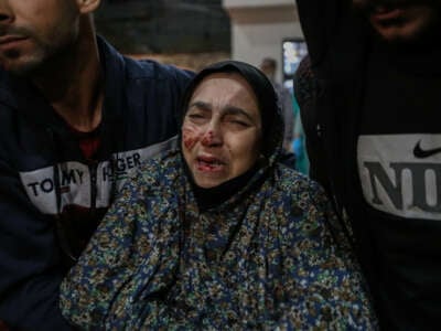 A Palestinian injured in Israeli air strikes arrives for treatment at Kuwait Hospital on March 1, 2024, in Rafah, Gaza.