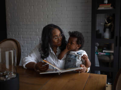 Jamie Heard reads to her son Legend at their home in Chelsea, Alabama, on March 5, 2024. Jaime's IVF process was halted due to the supreme court decision that embryos are considered children.