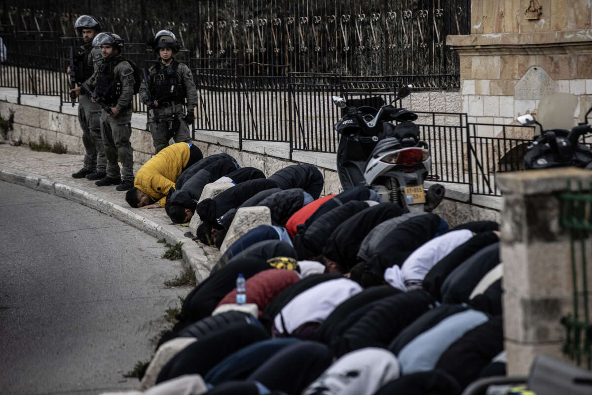 Palestinians perform Friday prayer on the street due to Israeli police turning away Palestinian young people from the checkpoints set up around Al-Aqsa Mosque in East Jerusalem, on March 8, 2024.