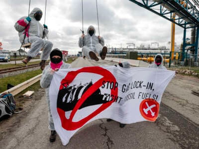 Members of the environmental group Ende Gelände block the access road to a floating LNG terminal in Brunsbüttel, Germany, on March 16, 2024.